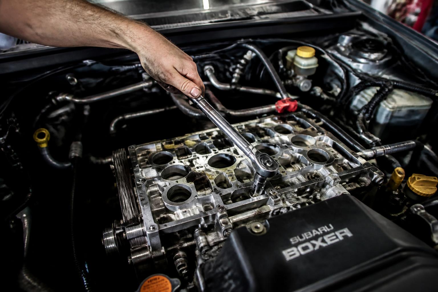 Mechanic working on a Subaru boxer engine